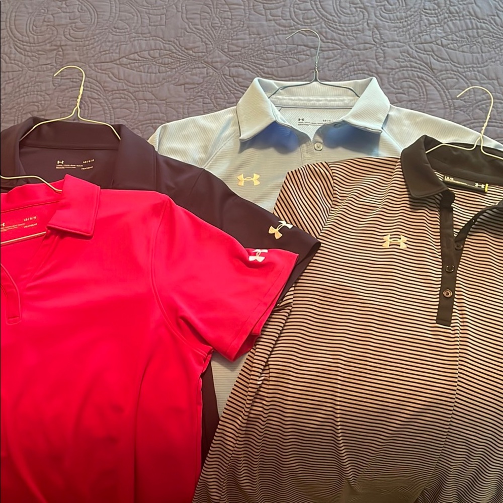 4 UA ladies golf polos.  Pink, navy, lt blue,blk/gray stripe. Lg. preowned